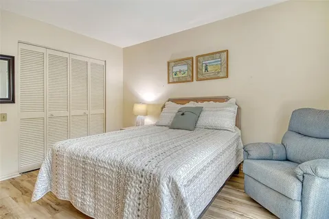 a view of a lake with houses in background