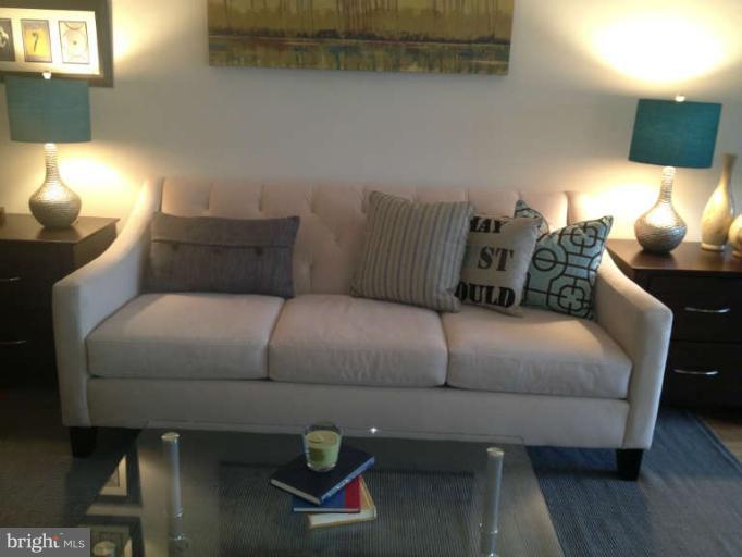 1311 Delaware Avenue Southwest, Unit S145 Washington, DC 20024 - Photo 3 of 9 a bedroom with a bed and window