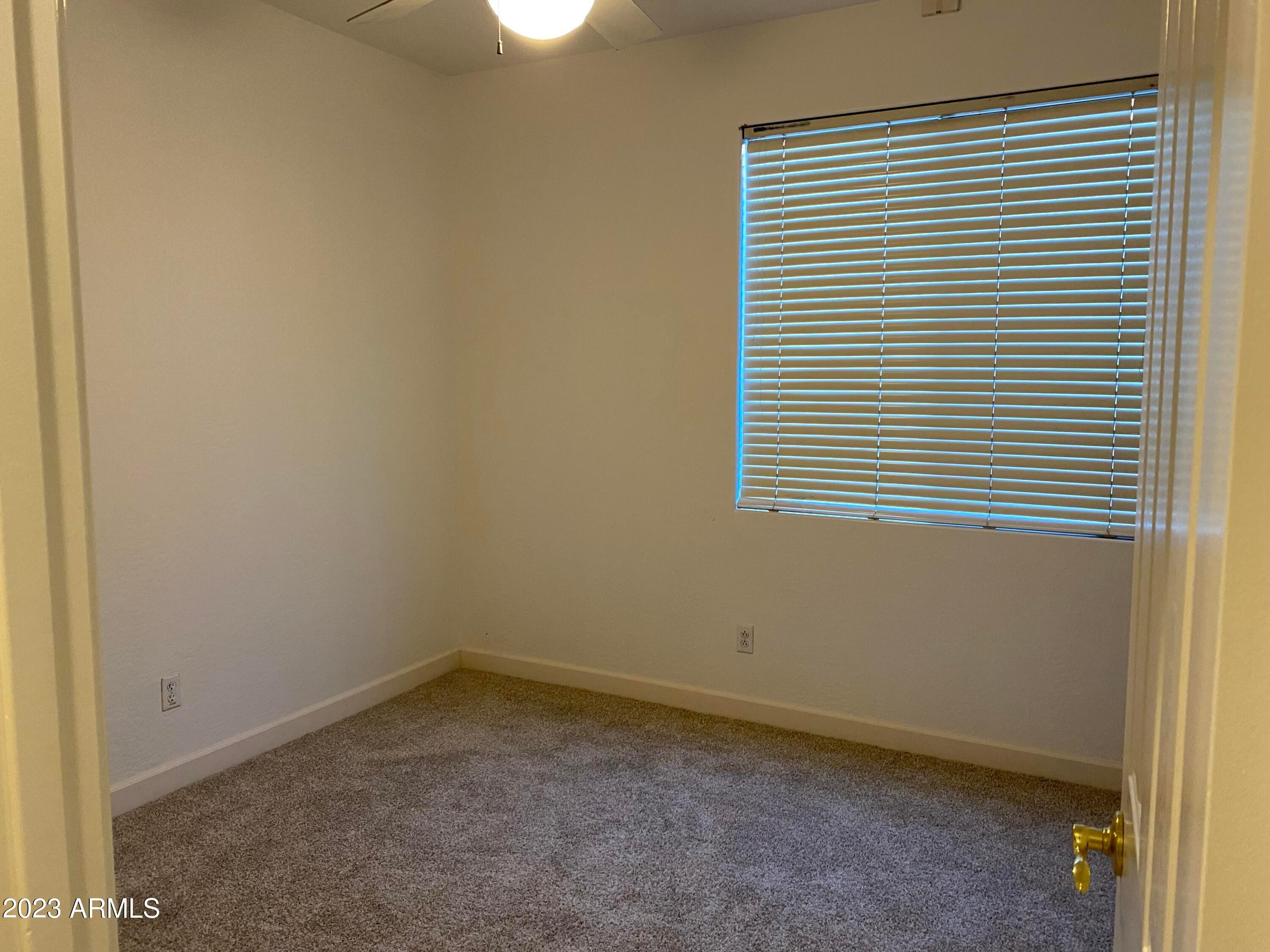 232 West Hawk Way Chandler, AZ 85286 - Photo 7 of 16 an empty room with a window