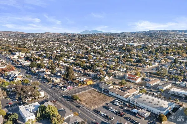 an aerial view of city and mountain
