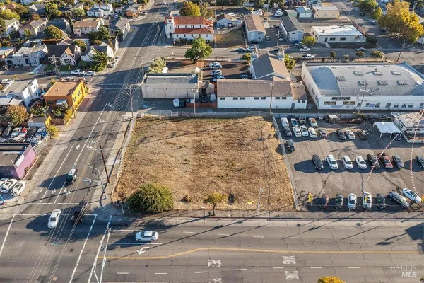 an aerial view of a building with parking space
