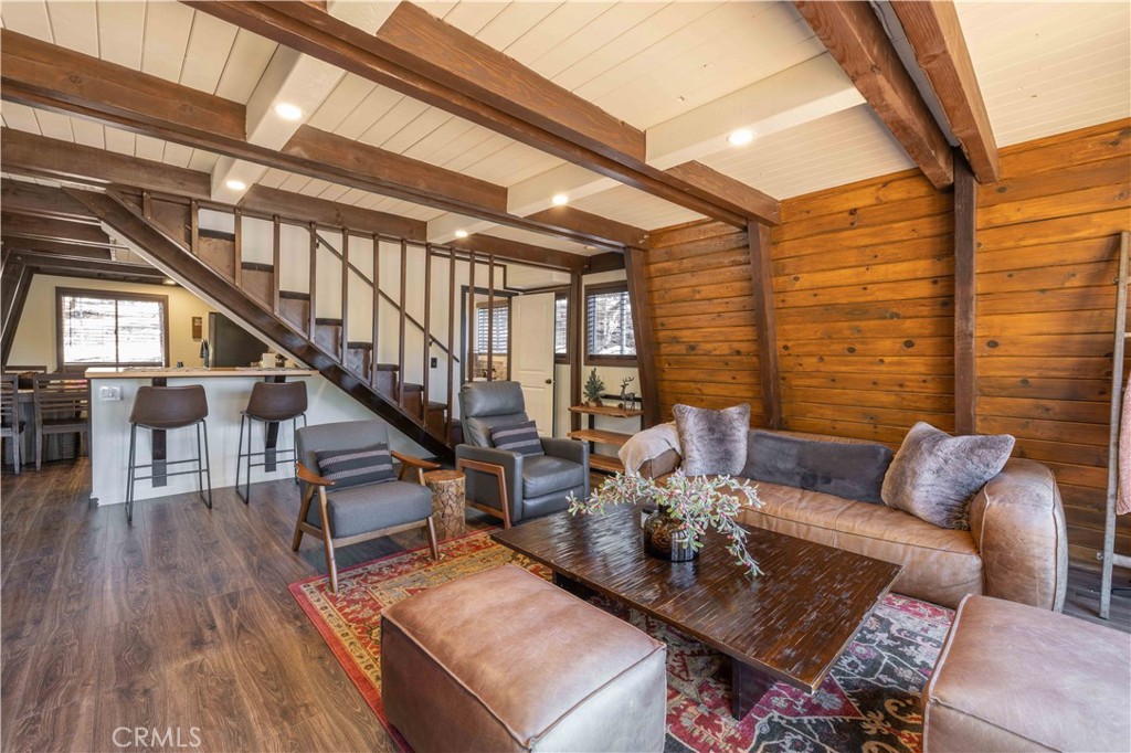 1107 Cedar Mountain Road Big Bear City, CA 92314 - Photo 16 of 42 a living room with furniture and wooden floor