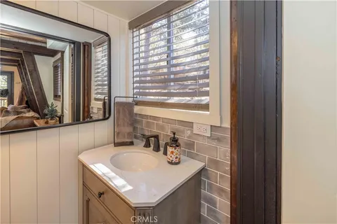 a white toilet sitting next to a shower curtain