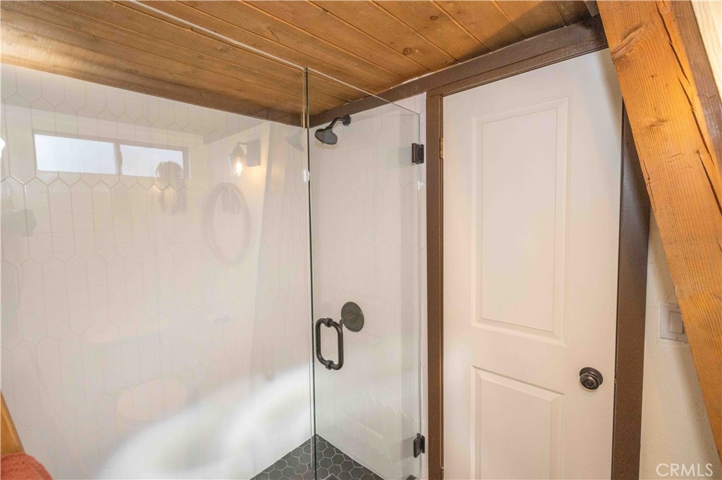 1107 Cedar Mountain Road Big Bear City, CA 92314 - Photo 25 of 42 a bathroom with a shower