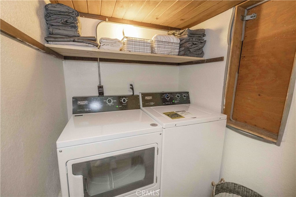 1107 Cedar Mountain Road Big Bear City, CA 92314 - Photo 35 of 42 a utility room with dryer and washer