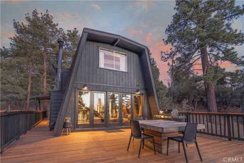 a front view of house with yard outdoor seating and barbeque oven