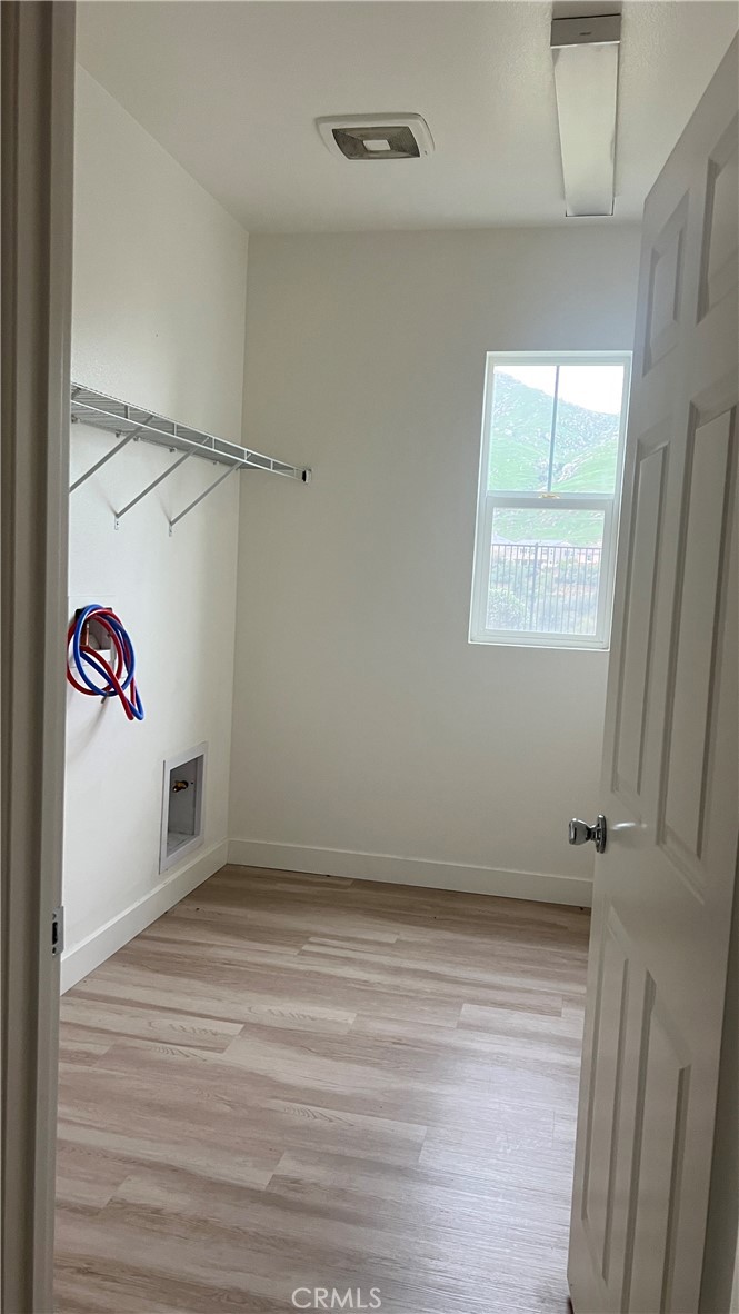20349 Barrel Road Riverside, CA 92507 - Photo 12 of 21 a view of a room with rack on the wall and a window