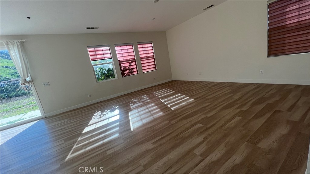 20349 Barrel Road Riverside, CA 92507 - Photo 13 of 21 a view of empty room with wooden floor and fan
