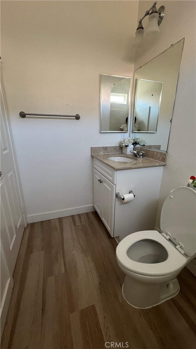 20349 Barrel Road Riverside, CA 92507 - Photo 14 of 21 a bathroom with a toilet sink and mirror