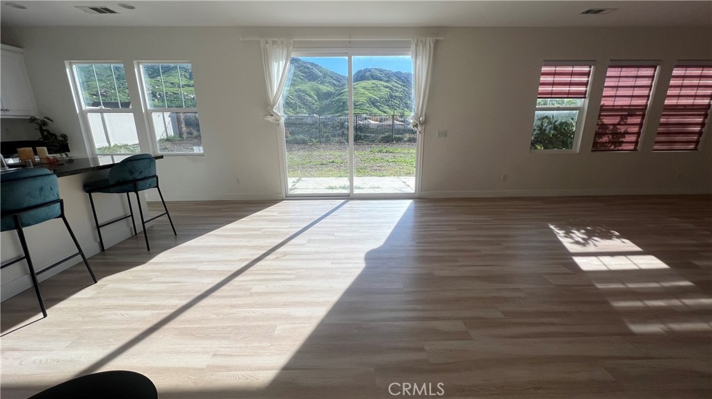 20349 Barrel Road Riverside, CA 92507 - Photo 15 of 21 a view of empty room with wooden floor and fan