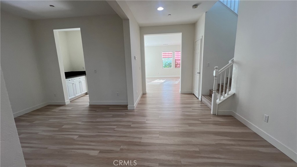 20349 Barrel Road Riverside, CA 92507 - Photo 21 of 21 a view of hallway with stairs and wooden floor