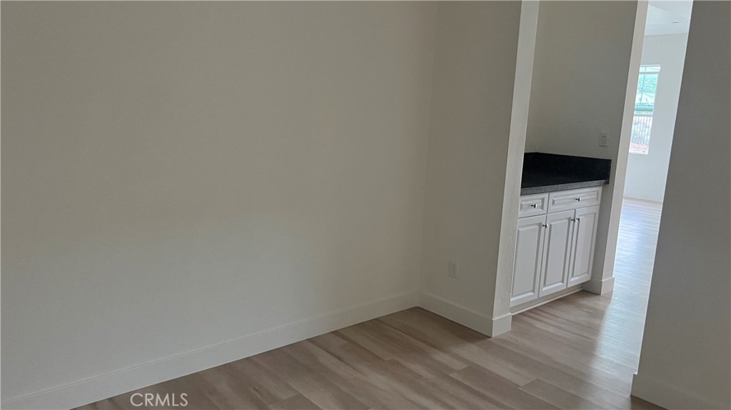 20349 Barrel Road Riverside, CA 92507 - Photo 9 of 21 a view of a hallway with wooden floor