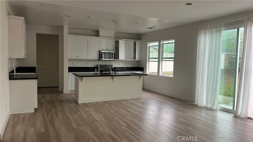 20349 Barrel Road Riverside, CA 92507 - Photo 10 of 21 a kitchen with stainless steel appliances granite countertop a stove a sink and a refrigerator