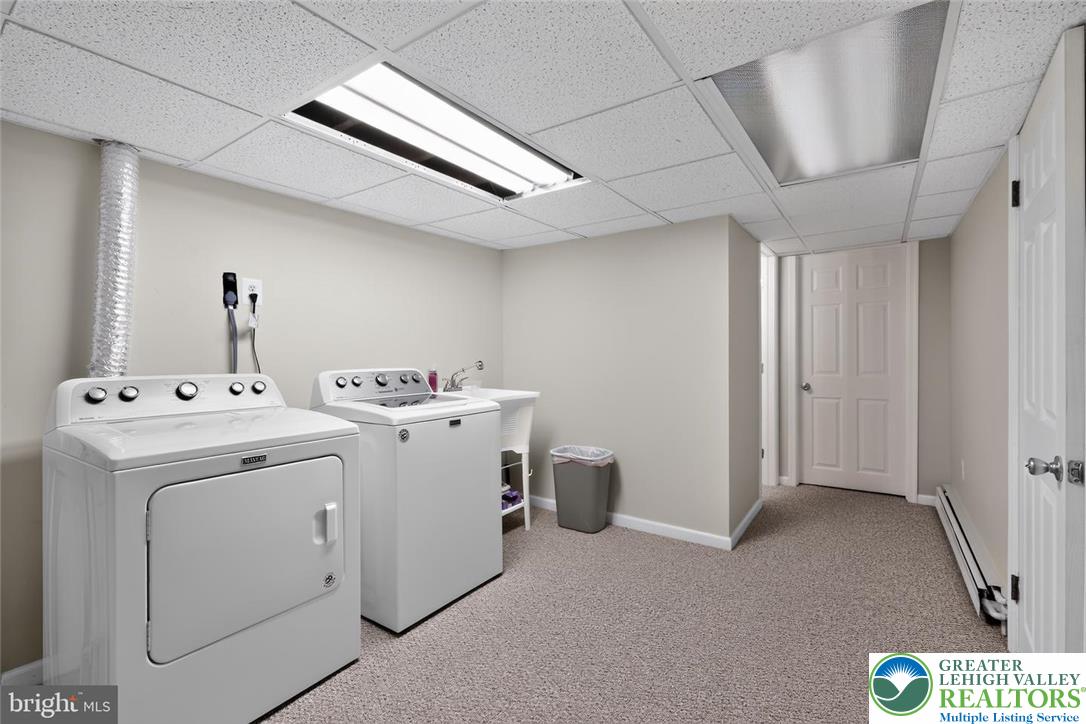 740 Public Road Bethlehem, PA 18015 - Photo 35 of 40 Functional laundry space with a washer, dryer, and textured flooring for everyday convenience.