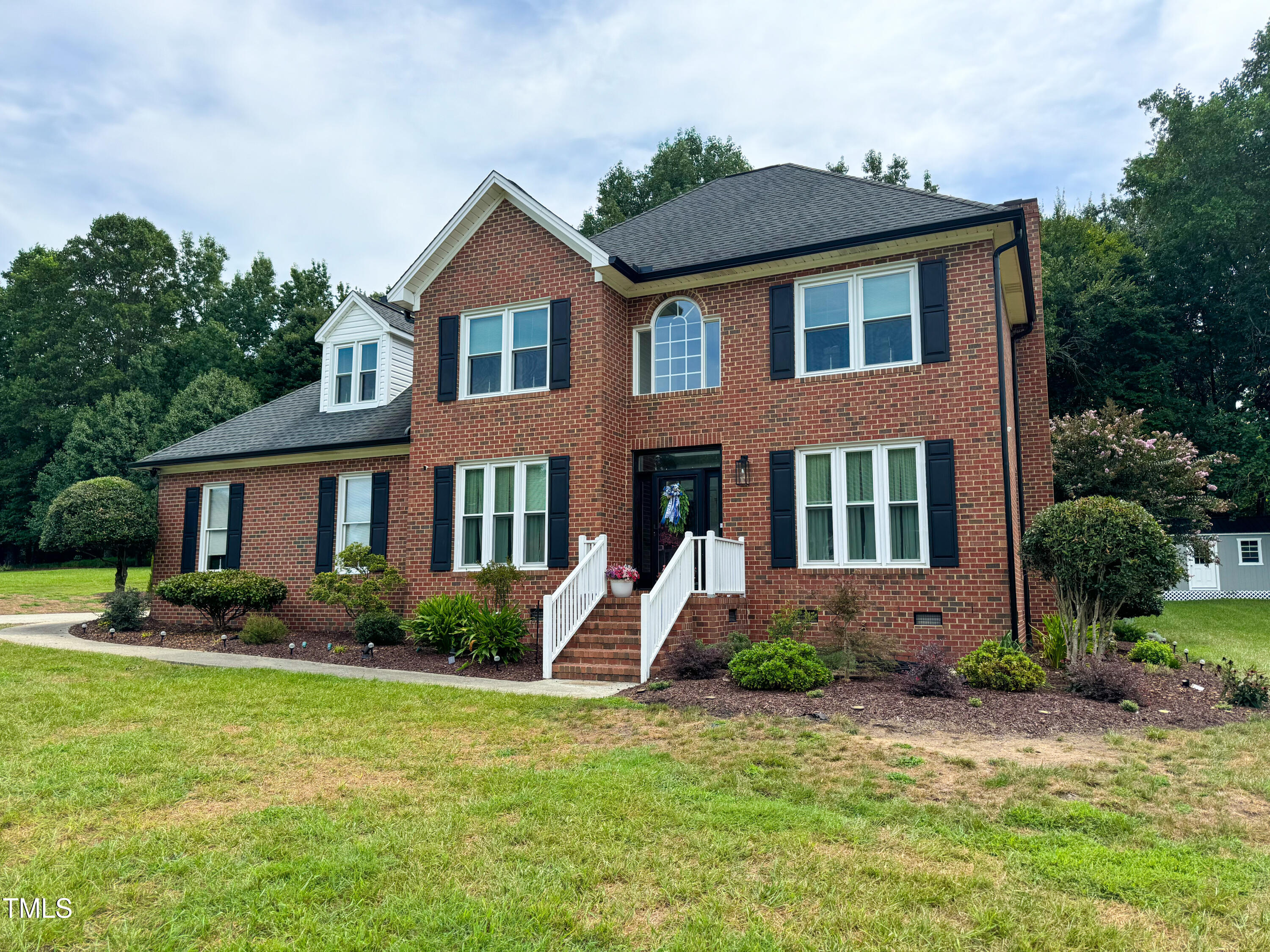 120 Denada Path Roxboro, NC 27574 - Photo 2 of 44 a front view of a house with garden