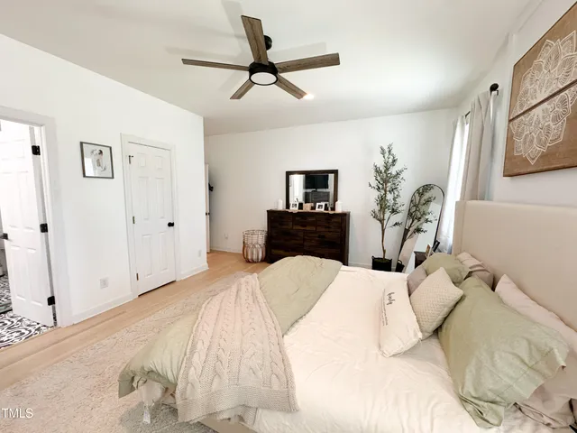 a bathroom with a shower sink and mirror