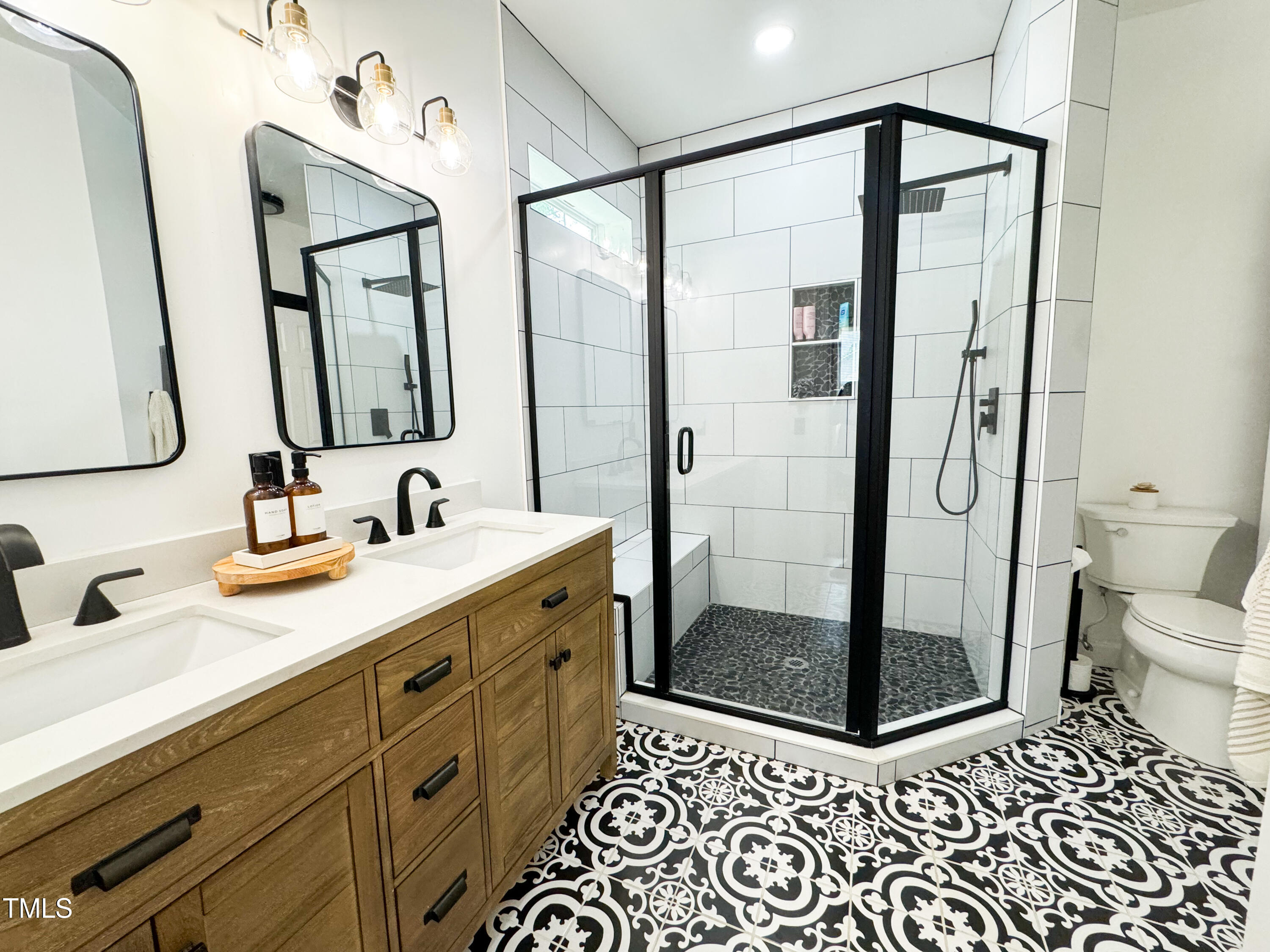 120 Denada Path Roxboro, NC 27574 - Photo 25 of 44 a bathroom with a shower sink and mirror