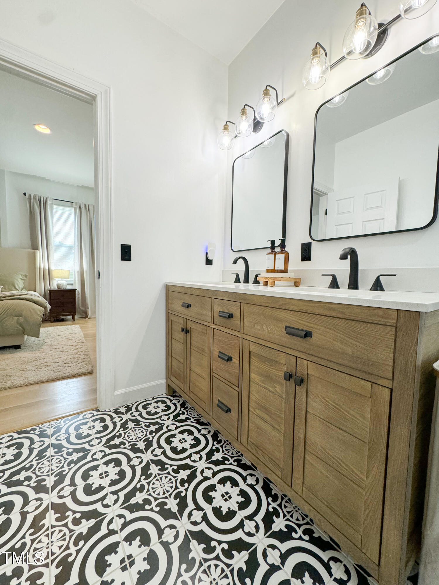 120 Denada Path Roxboro, NC 27574 - Photo 26 of 44 a bathroom with a double vanity sink and a mirror