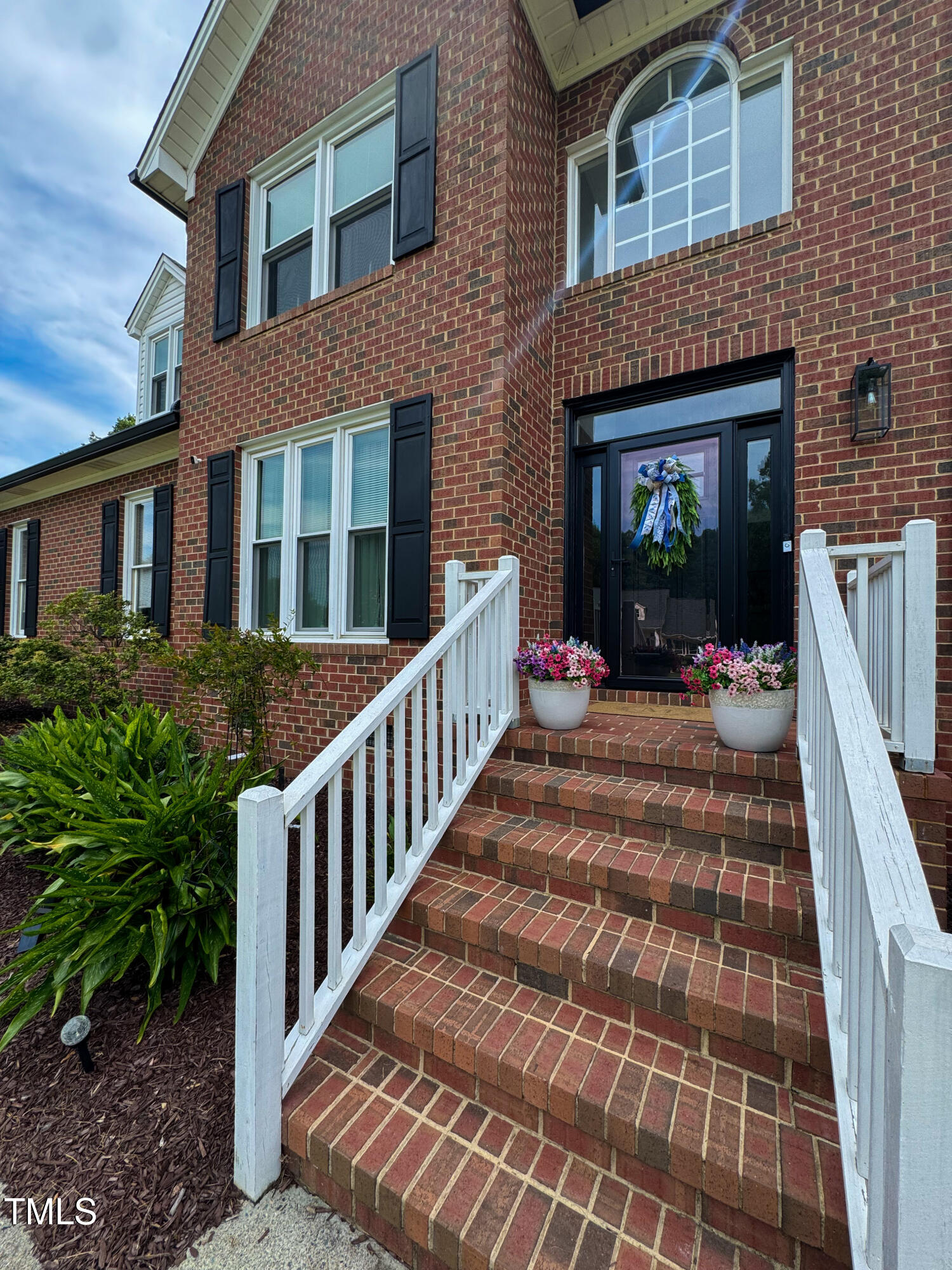 120 Denada Path Roxboro, NC 27574 - Photo 3 of 44 a view of a brick building with many windows