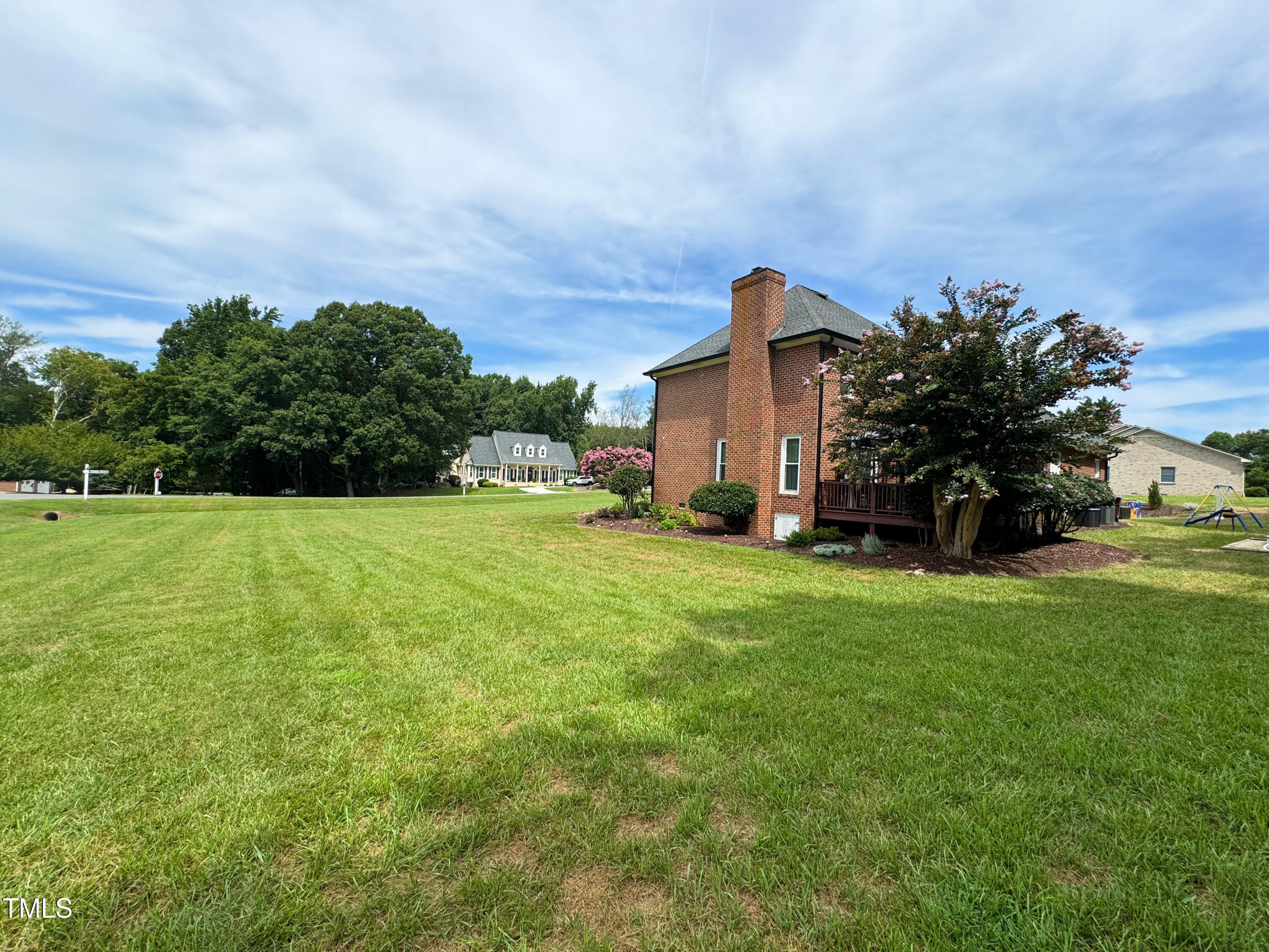 120 Denada Path Roxboro, NC 27574 - Photo 39 of 44 a view of a house with a big yard potted plants and large trees