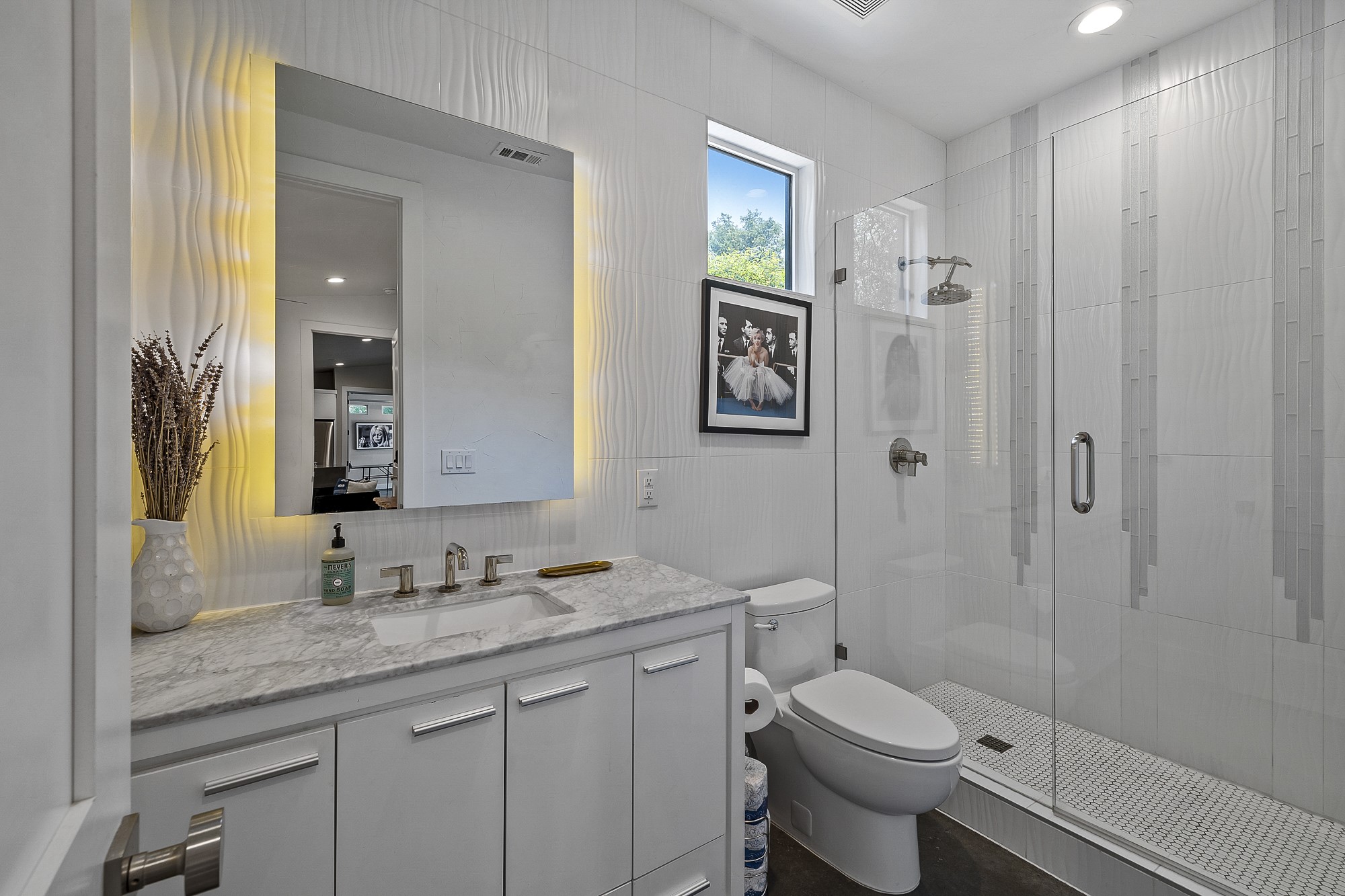 2414 Kinney Road Austin, TX 78704 - Photo 39 of 40 a bathroom with a granite countertop toilet sink and shower