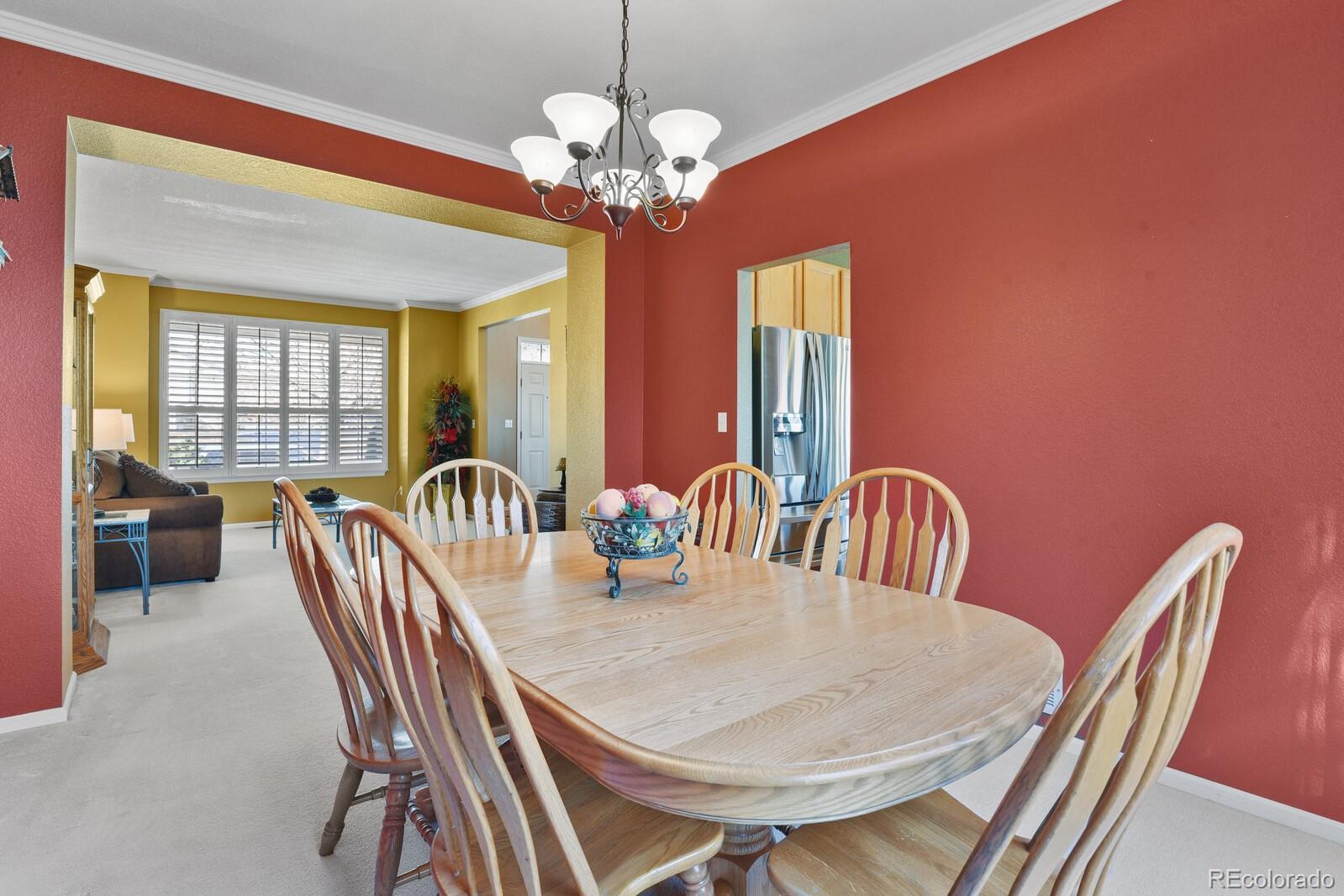 10144 Spring Water Court Highlands Ranch, CO 80129 - Photo 4 of 40 a view of a dining room with furniture