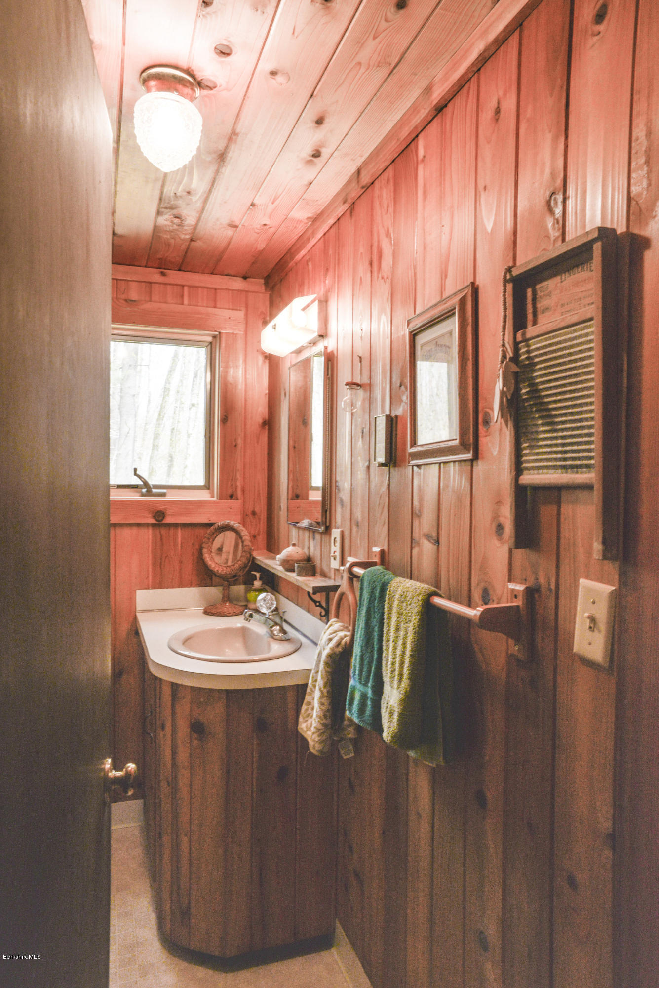 43 Path Road Tolland, MA 01034 - Photo 16 of 35 a bathroom with a sink toilet and mirror