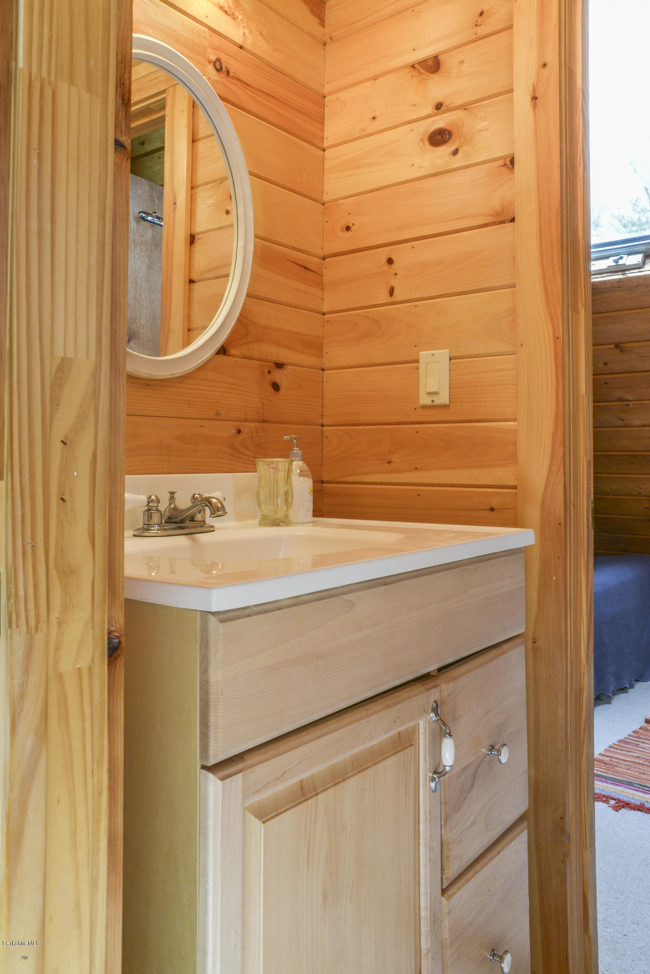 43 Path Road Tolland, MA 01034 - Photo 20 of 35 a bathroom with a sink and a mirror
