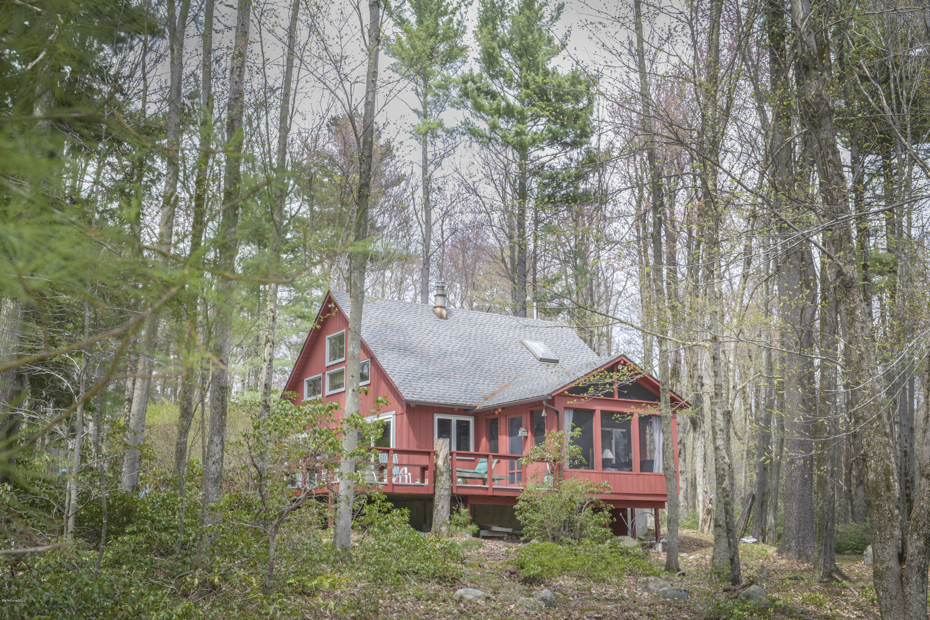 43 Path Road Tolland, MA 01034 - Photo 4 of 35 a view of a house with a chairs and table in a yard
