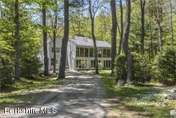 43 Path Road Tolland, MA 01034 - Photo 33 of 35 a view of a big yard in front of a house with large trees
