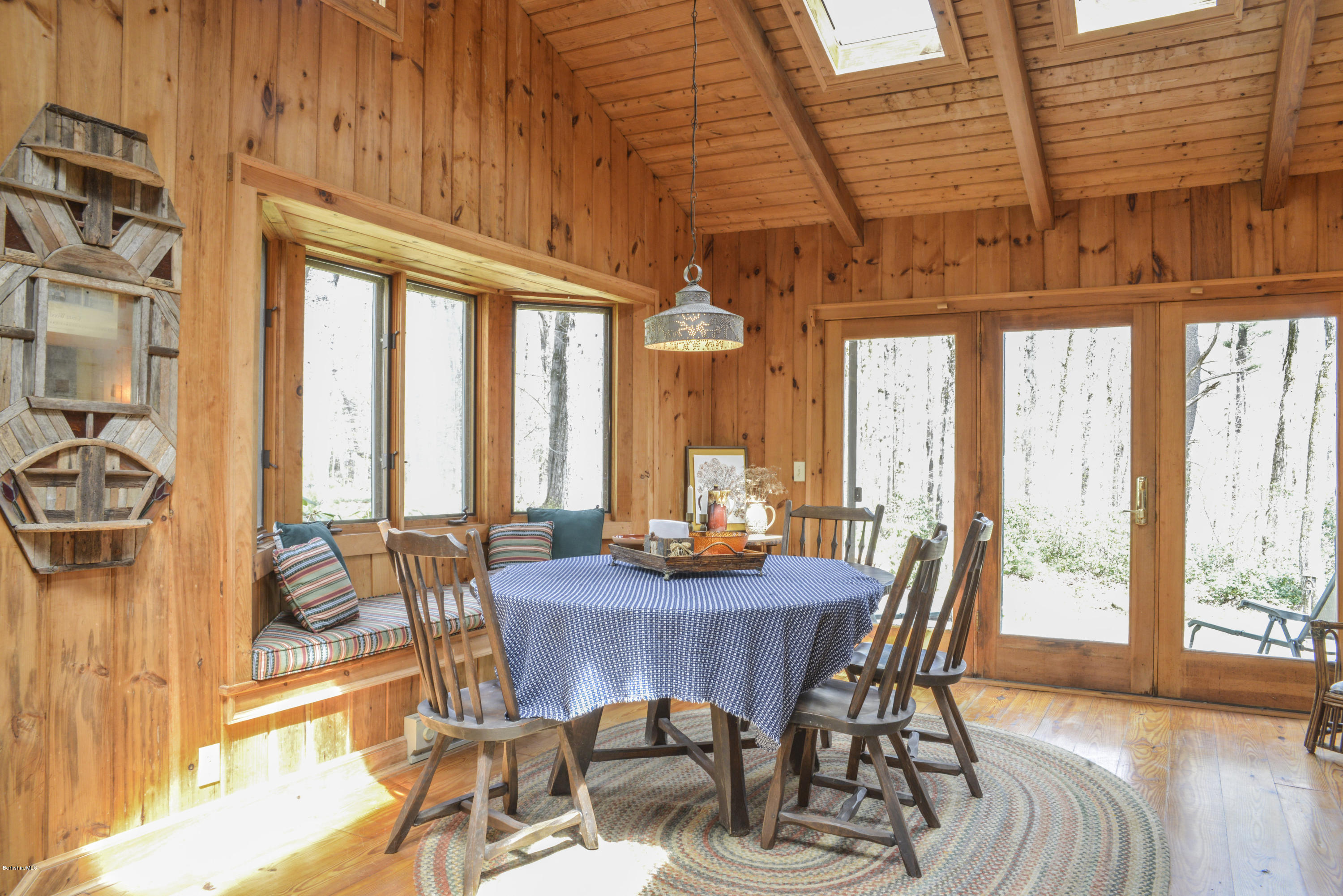 43 Path Road Tolland, MA 01034 - Photo 6 of 35 a view of a dining room with furniture large windows and wooden floor