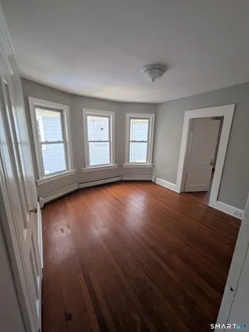 a view of livingroom with hardwood floor and window