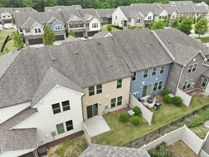 a aerial view of a house with a yard