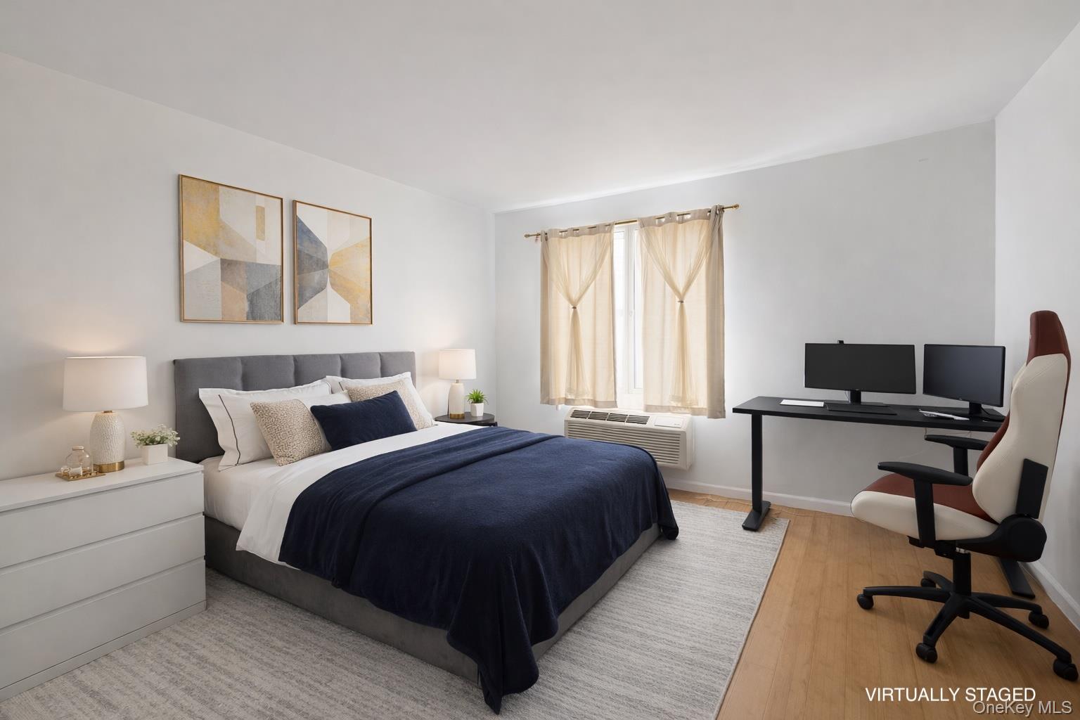 112-02 Northern Boulevard, Unit 2B Queens, NY 11368 - Photo 4 of 13 a bedroom with a bed and a desk