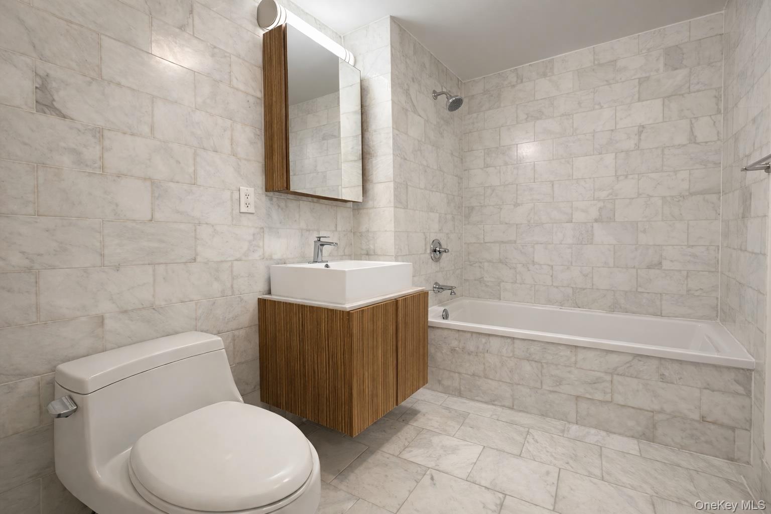 112-02 Northern Boulevard, Unit 2B Queens, NY 11368 - Photo 6 of 13 a bathroom with a toilet sink and mirror