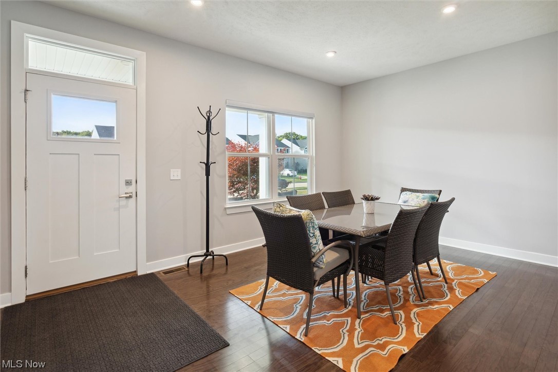 View of wood floored dining area
