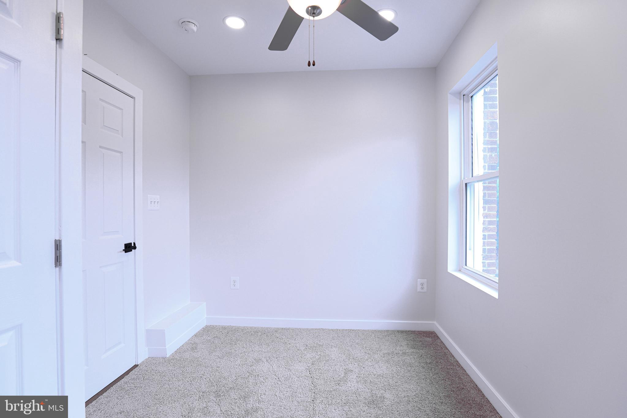 2039 Rosedale Street Northeast Washington, DC 20002 - Photo 9 of 18 an empty room with windows and closet