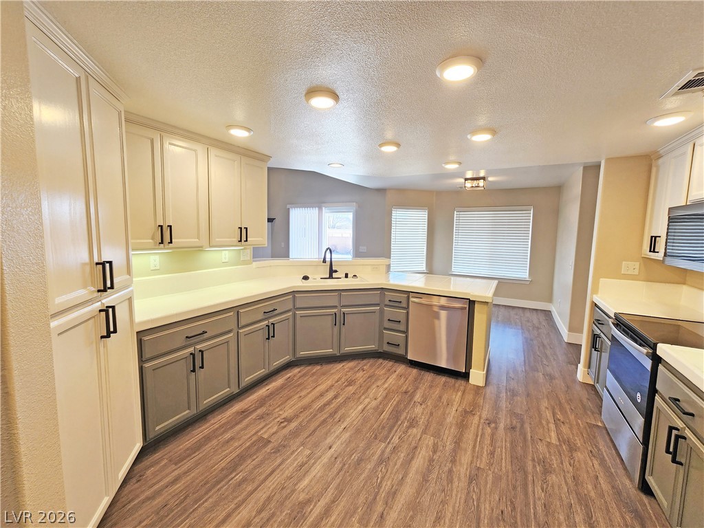 4591 Stoneham Street Pahrump, NV 89061 - Photo 22 of 42 Culinary delights await in this contemporary kitchen, featuring ample counter space and stylish cabinetry.