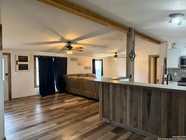 a kitchen with a refrigerator and a sink
