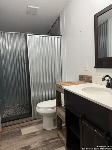 a bathroom with a sink and a toilet