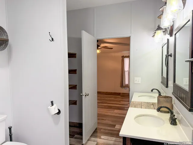 a bathroom with a sink and mirror