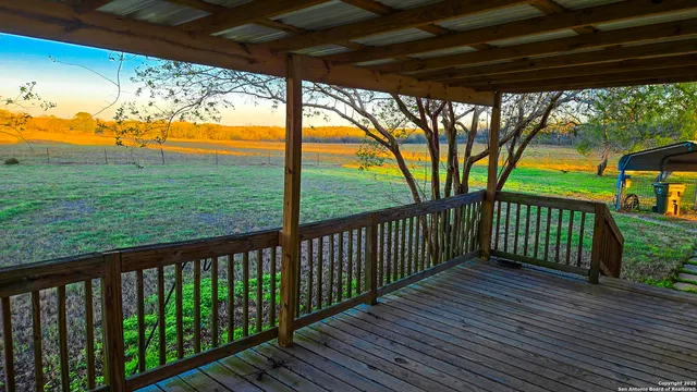 a view of a porch with a yard