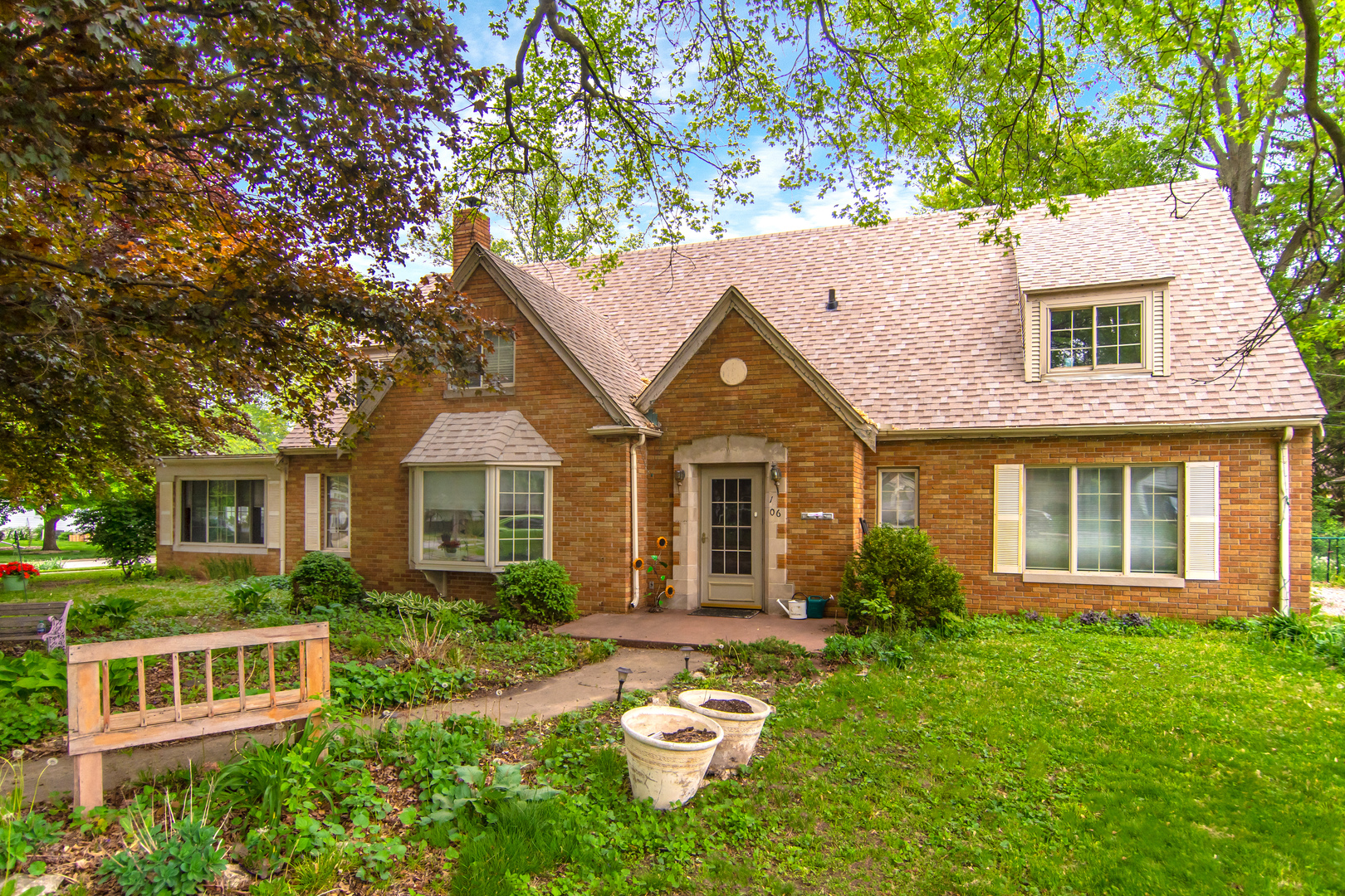 front view of a house with a yard