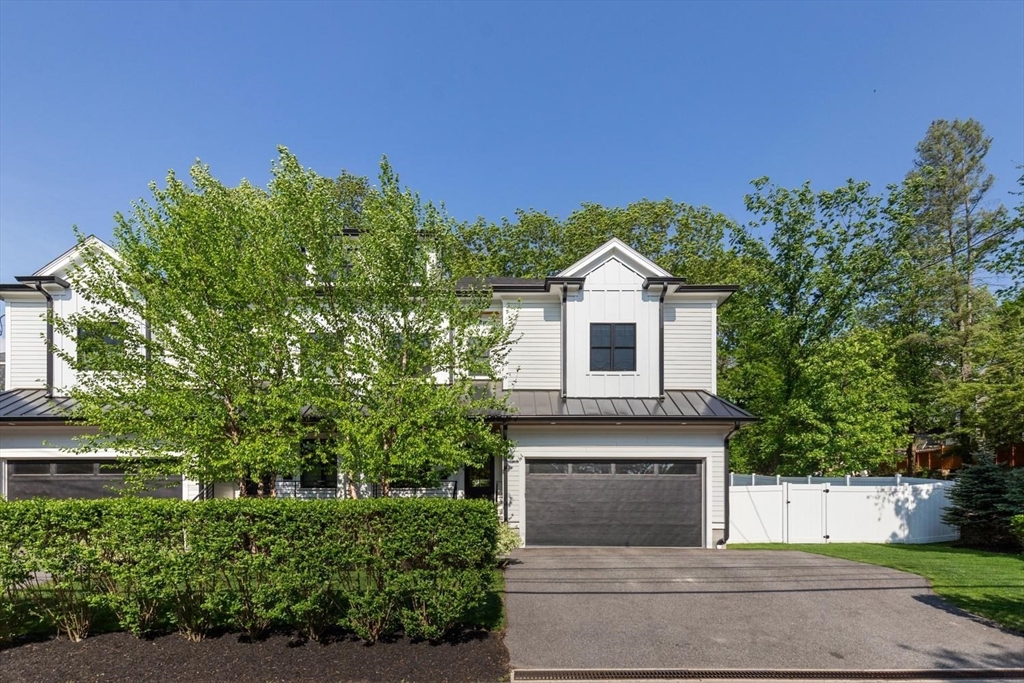 1124 Chestnut Street Newton, MA 02464 - Photo 32 of 41 a front view of a house with a yard and trees