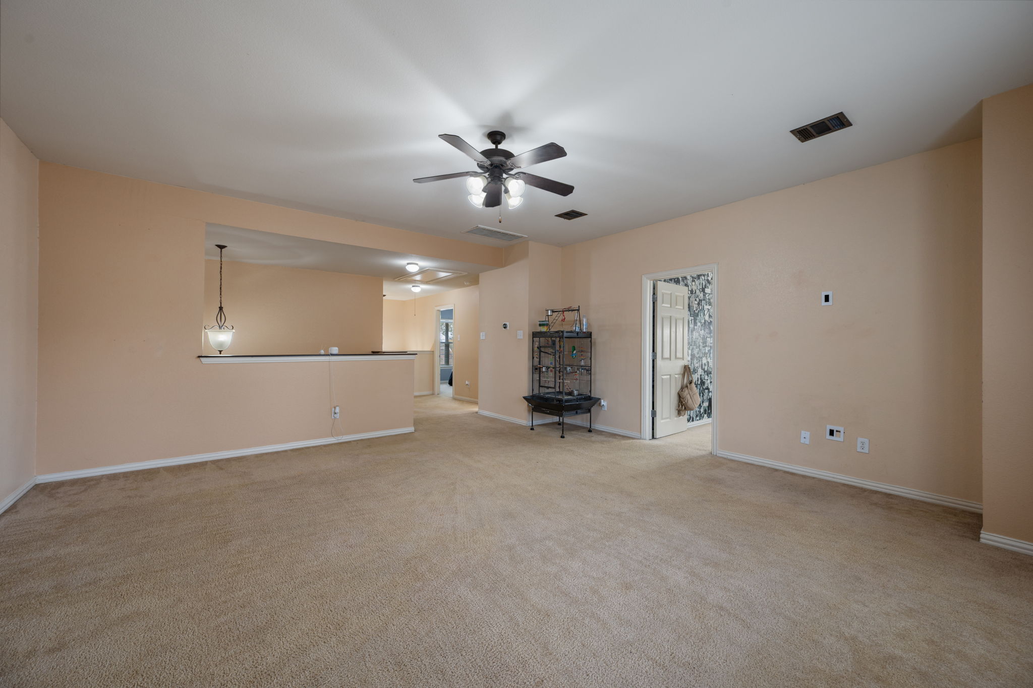 2415 Elkhorn Ranch Road Leander, TX 78641 - Photo 15 of 39 a view of a big room with chandelier fan and windows
