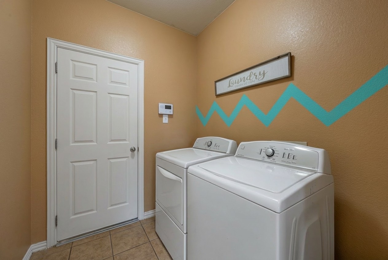 2415 Elkhorn Ranch Road Leander, TX 78641 - Photo 16 of 39 a utility room with dryer and washer