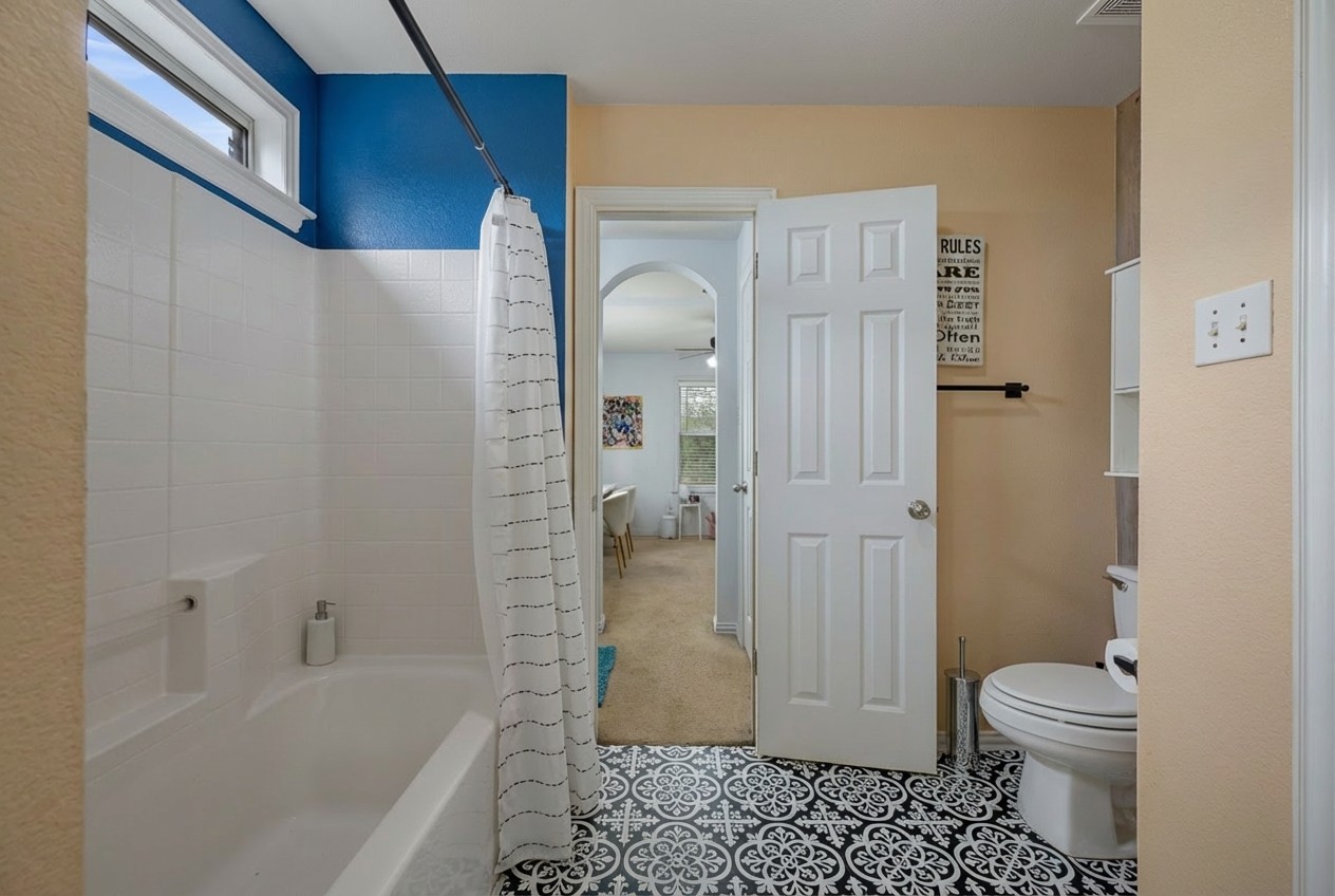 2415 Elkhorn Ranch Road Leander, TX 78641 - Photo 20 of 39 a bathroom with a sink a toilet and shower