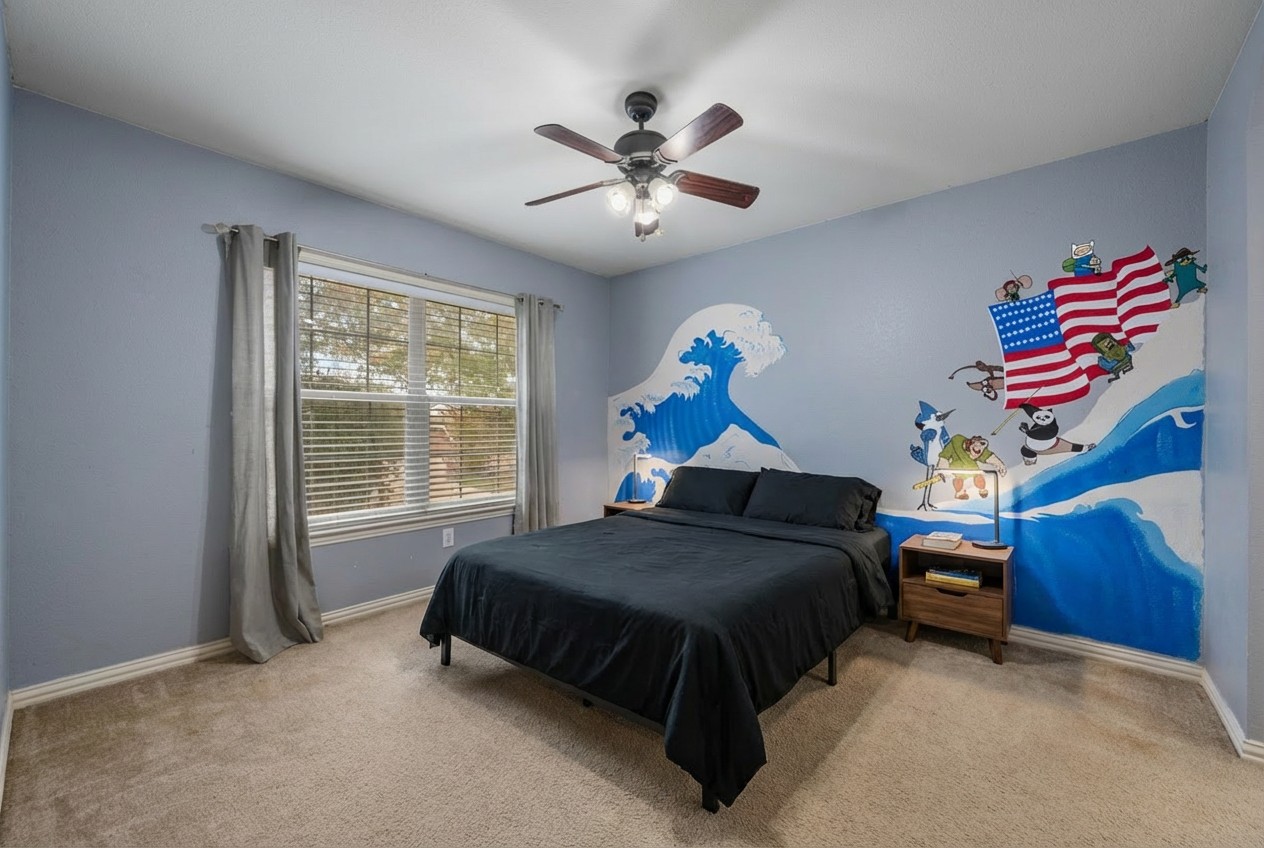 2415 Elkhorn Ranch Road Leander, TX 78641 - Photo 21 of 39 a bedroom with a bed and a chandelier