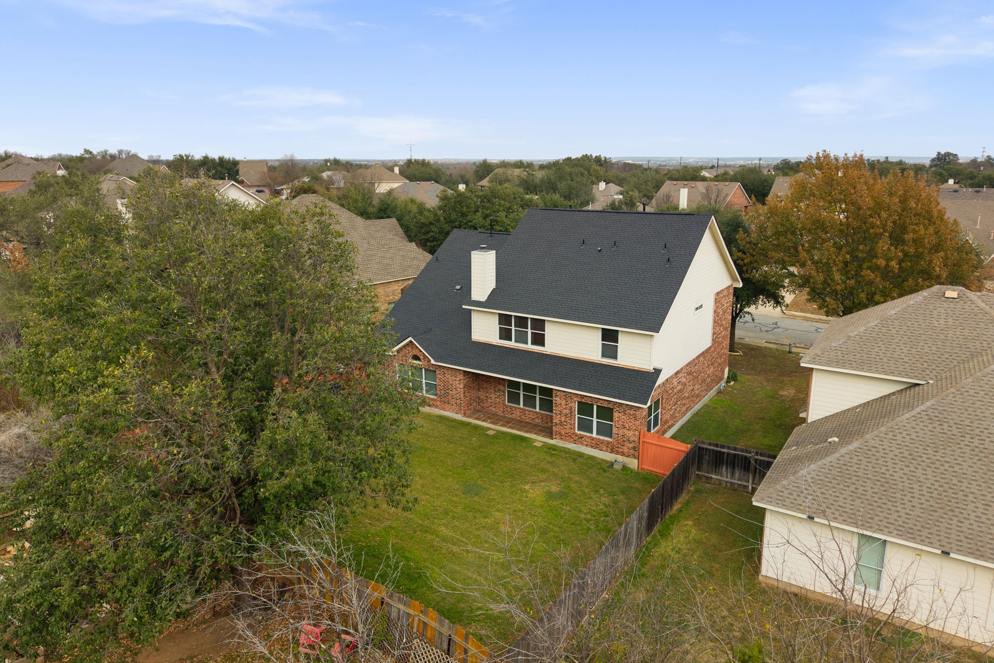 2415 Elkhorn Ranch Road Leander, TX 78641 - Photo 28 of 39 an aerial view of residential houses with outdoor space and trees