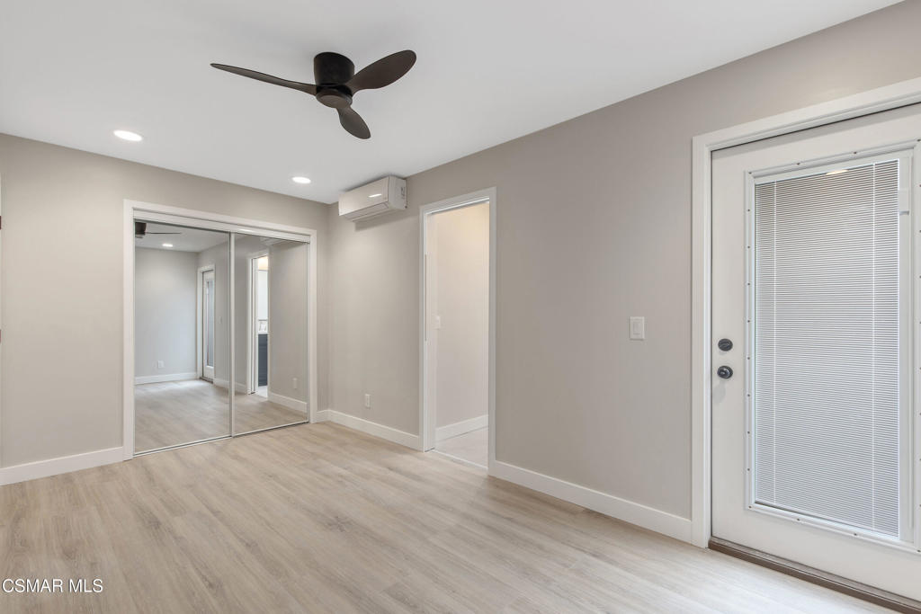 313 Raymond Street, Unit A Ojai, CA 93023 - Photo 13 of 32 wooden floor in an empty room with a window